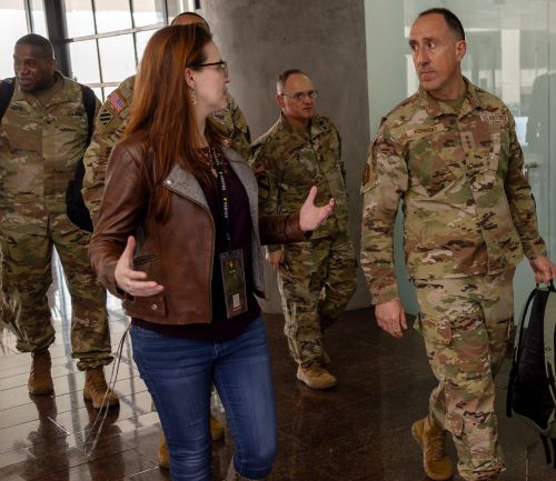 Group of Soldiers walking with Director